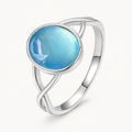 Aquamarin Cabochonring mit ovalem Stein und gekreuzter Ringschiene