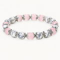 Rosenquarz-Howlit Armband mit ornamentalen Perlenkappen