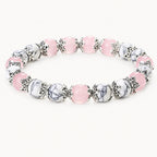 Rosenquarz-Howlit Armband mit ornamentalen Perlenkappen
