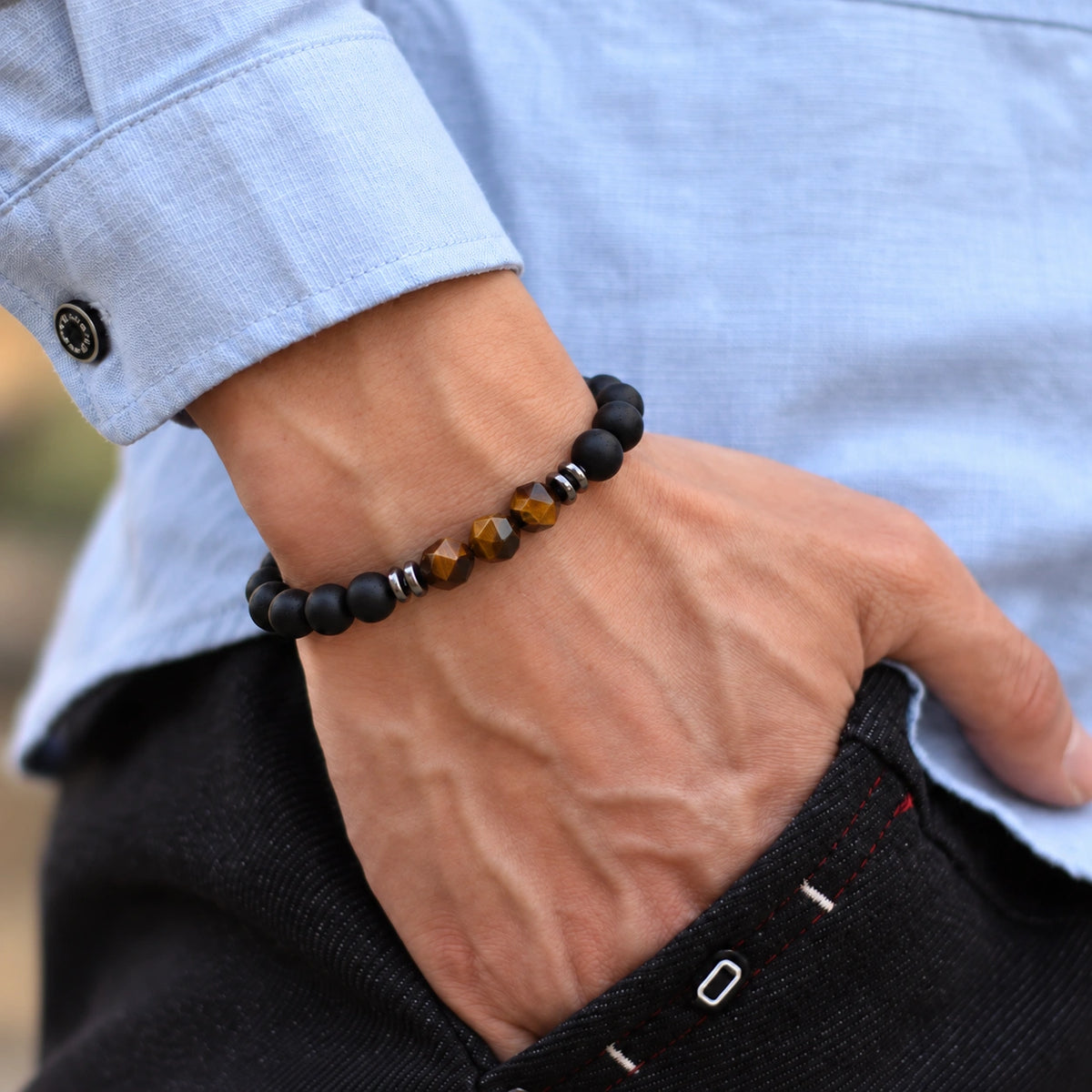 Onyx Armband mit facettierten Tigerauge-Perlen