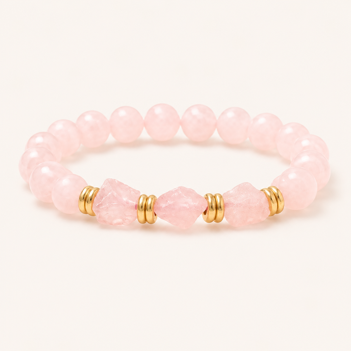 Rosenquarz Perlenarmband mit facettierten Mittelsteinen