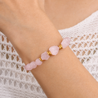 Rosenquarz Perlenarmband mit facettierten Mittelsteinen