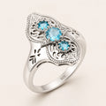 Aquamarin-Ring mit drei Steinen und filigranen Ornamenten