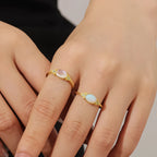 Gold Mondstein Ring mit länglichem Cabochon und Perlrand