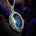 Aquamarin Kette aus 925er Silber mit ovalem Stein und filigranem Rahmen