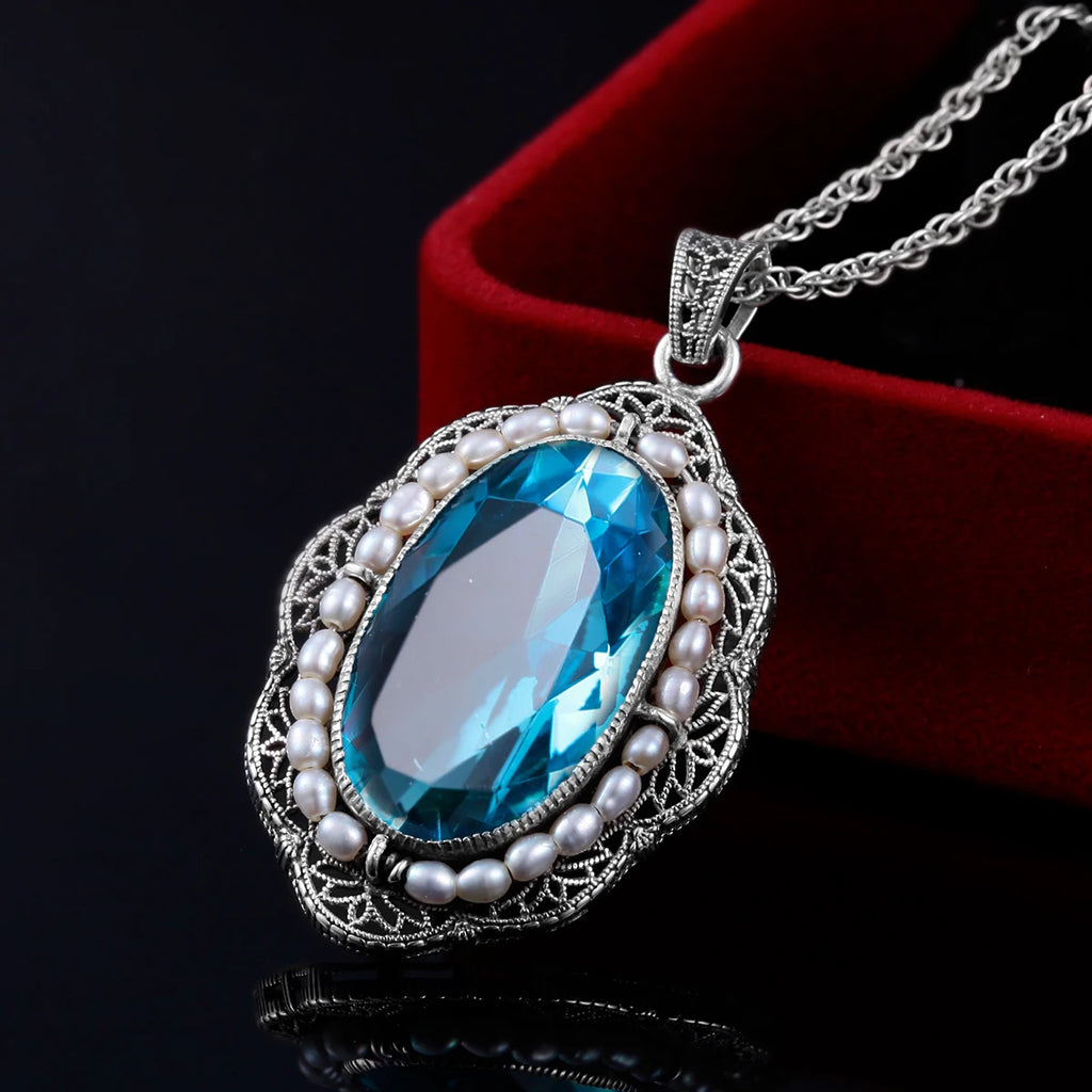 Aquamarin Kette aus 925er Silber mit ovalem Stein und filigranem Rahmen