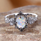 Opal Ring mit floralem Rahmen und Ziersteinen