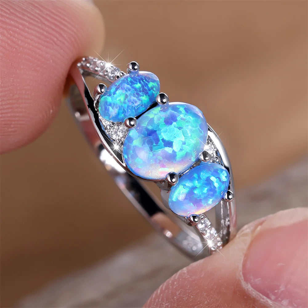Blauer Opal Ring mit drei ovalen Steinen
