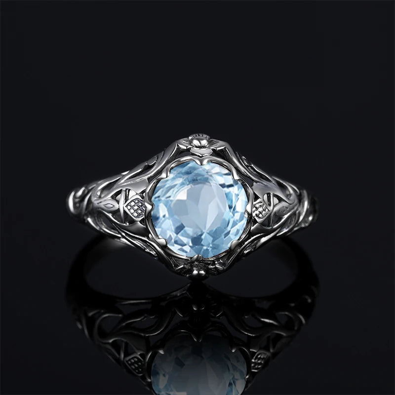Aquamarin Ring antik aus 925er Silber mit rundem Stein und reich verzierten Seiten