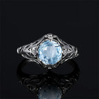 Aquamarin Ring antik aus 925er Silber mit rundem Stein und reich verzierten Seiten