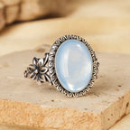 Aquamarin Cabochonring aus 925er Silber mit Blüten und Spiralrahmen