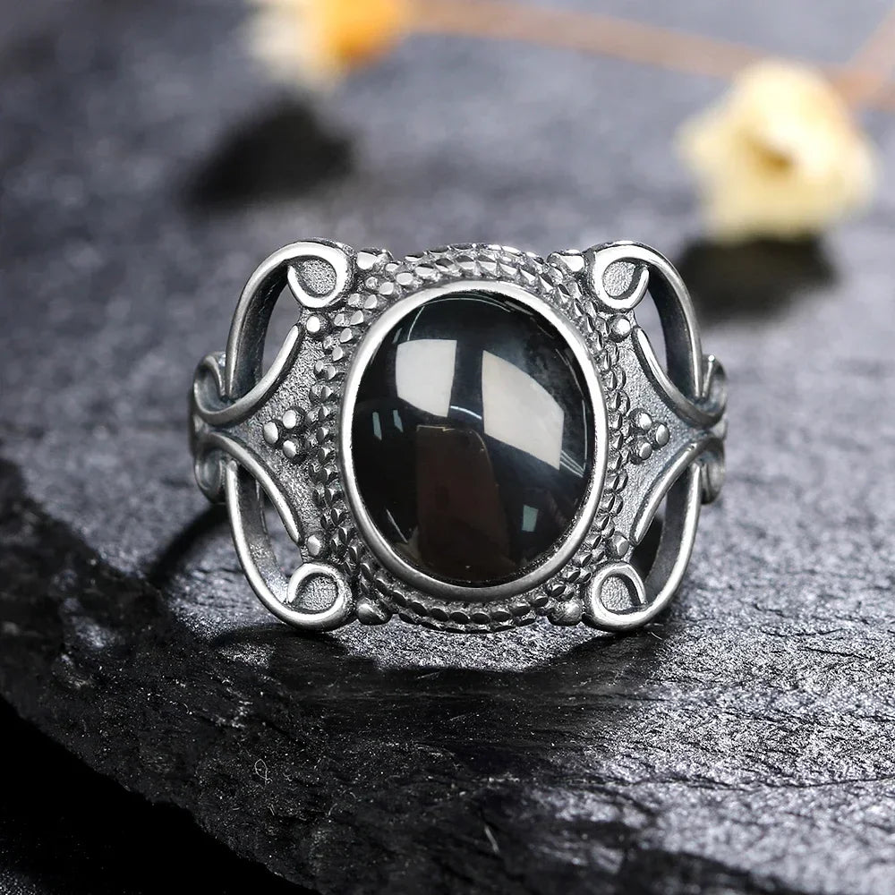 Vintage Onyx Ring aus 925er Silber mit durchbrochenem Ornamentrahmen