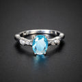 Aquamarin Look Ring mit ovalem Stein und Blattornamenten