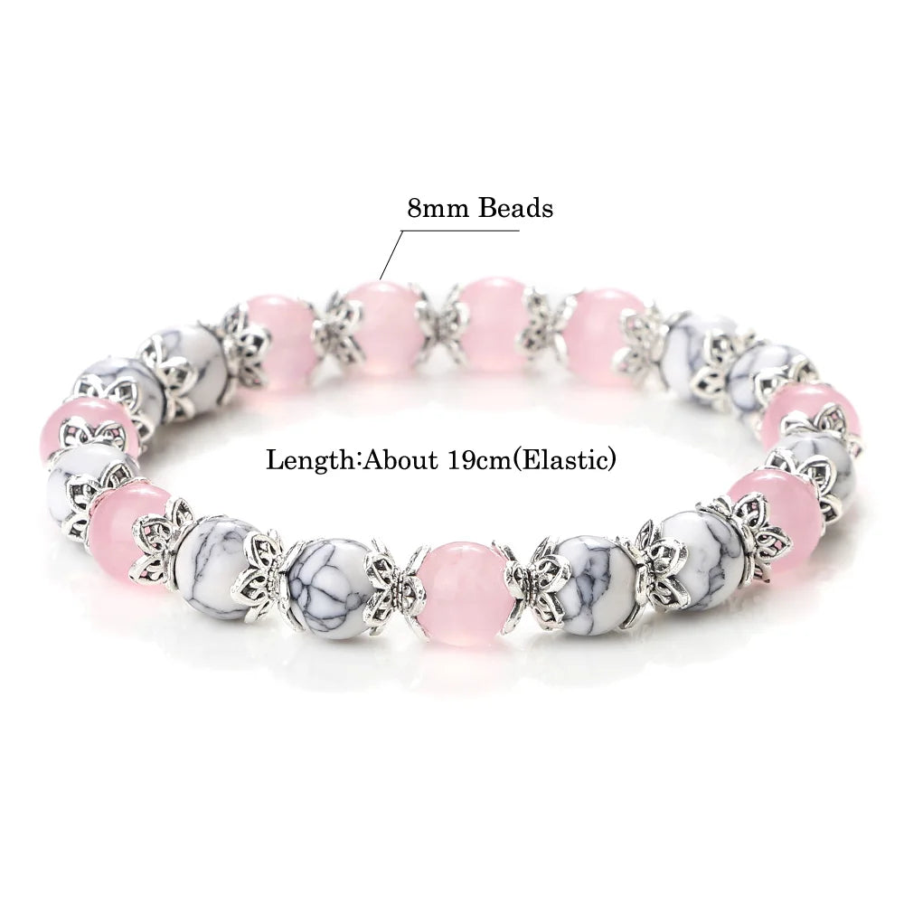 Rosenquarz-Howlit Armband mit ornamentalen Perlenkappen