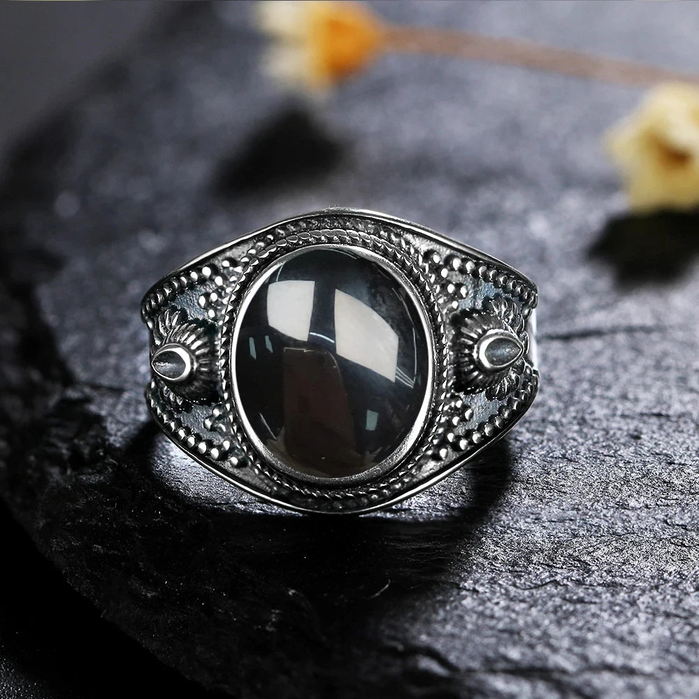 Breiter Onyx Ring aus 925er Silber mit seitlichen Rosetten