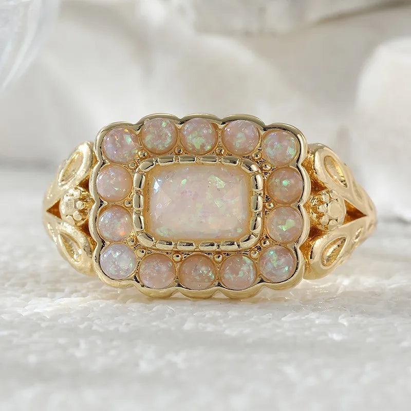 Opal Look Ring mit rechteckigem Mittelstein und Steinrahmen