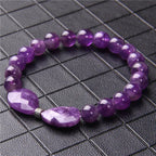 Amethyst Perlenarmband mit zwei facettierten Steinen