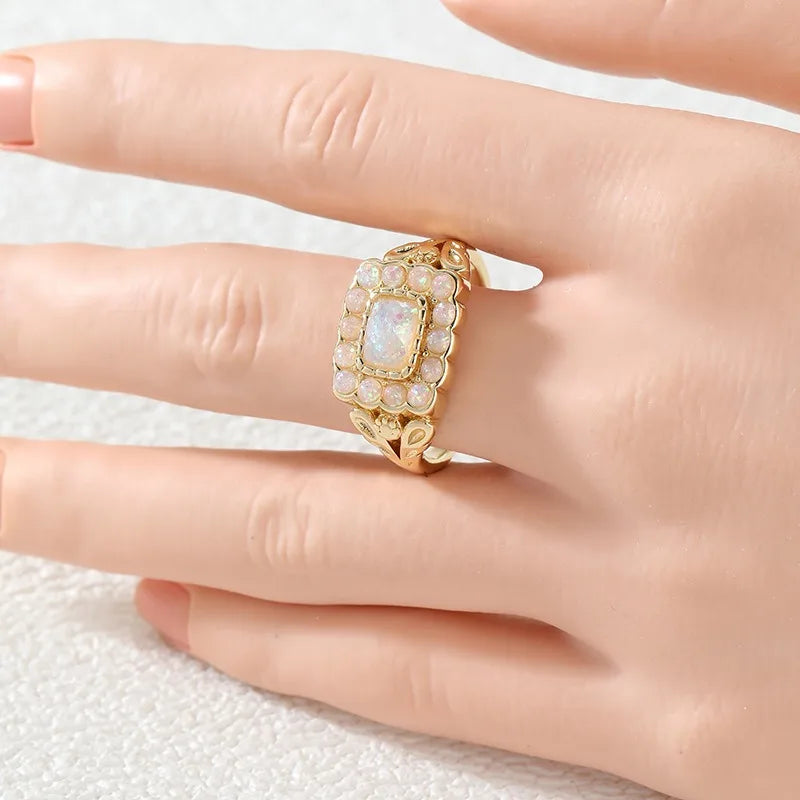 Opal Look Ring mit rechteckigem Mittelstein und Steinrahmen