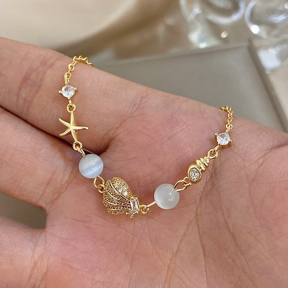Mondstein Armband mit Muschel und Seestern
