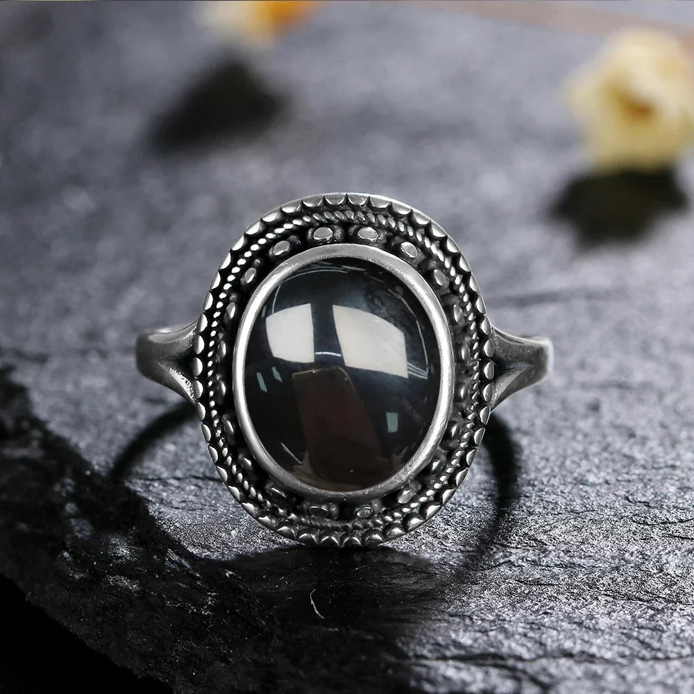 Vintage Onyx Ring aus 925er Silber mit ovalem Cabochon und Reliefrahmen