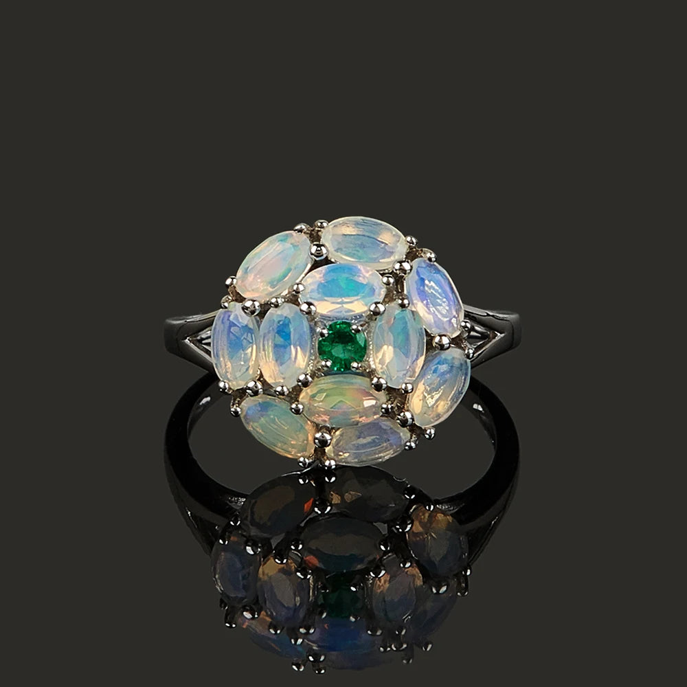 Opal Ring aus 925er Silber mit Smaragdzentrum und Opalblüte