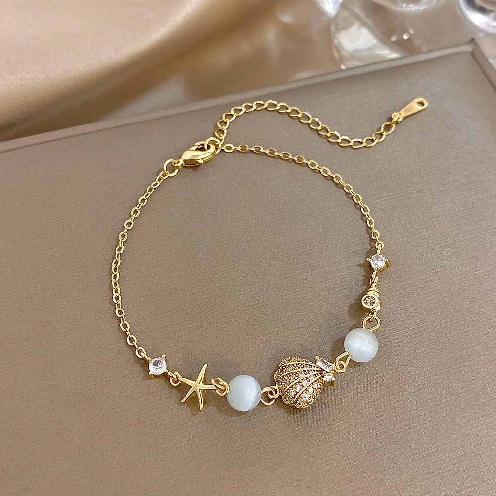 Mondstein Armband mit Muschel und Seestern