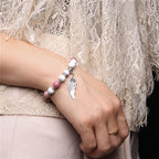 Rosenquarz Howlit Armband mit Flügel