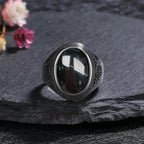 Onyx Siegelring aus 925er Silber mit ovalem Cabochon und Strukturrahmen