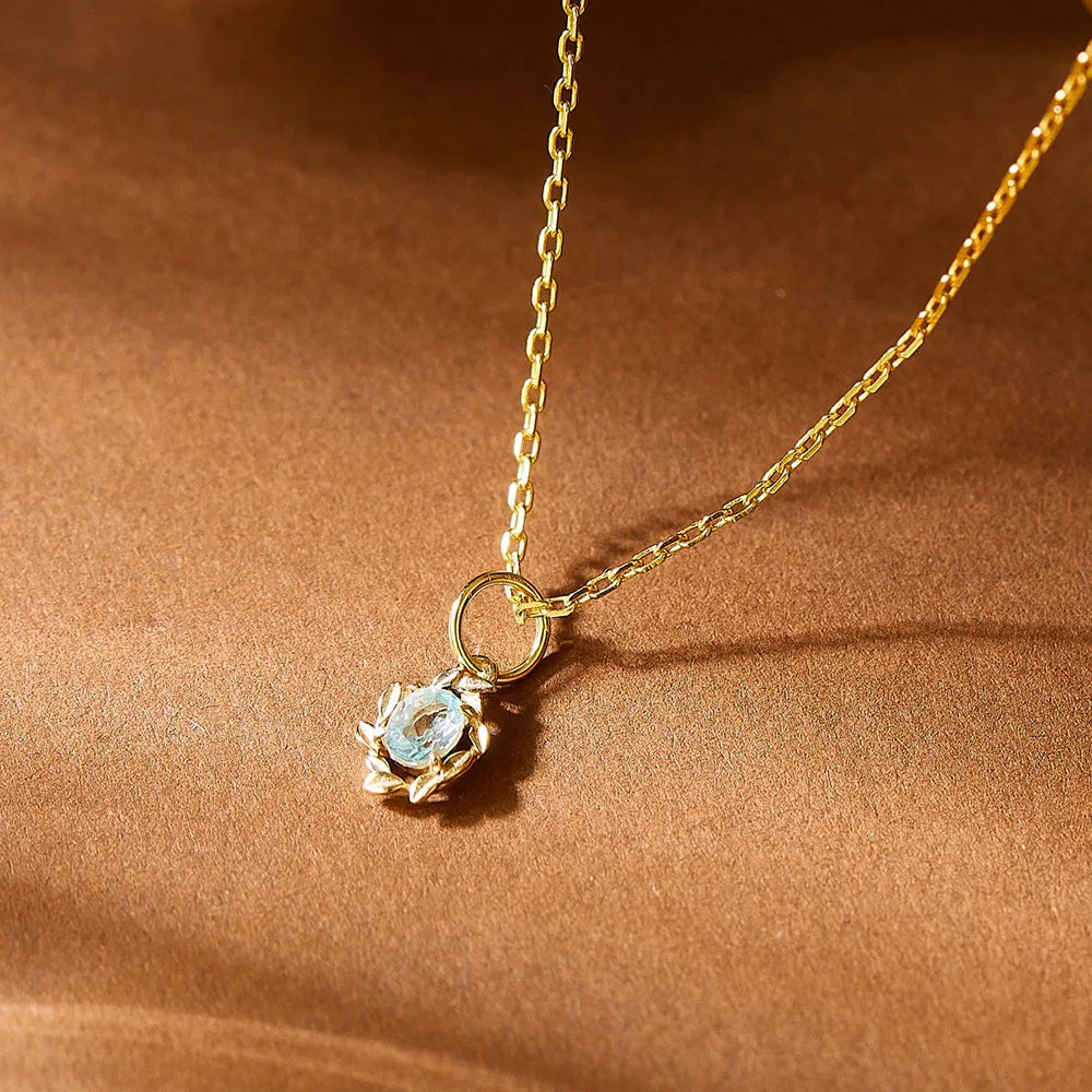 Aquamarin Kette aus 925er Silber mit ovalem Anhänger und Blättermotiv