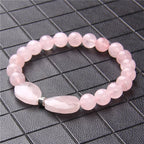 Rosenquarz Perlenarmband mit zwei Tropfensteinen