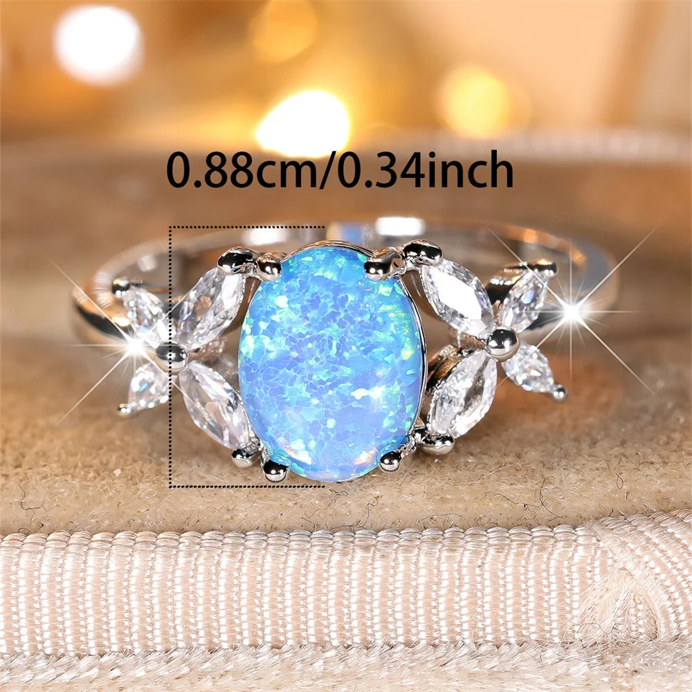 Blauer Opal Ring mit ovalem Stein und Blattmotiven