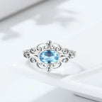 Jugendstil Aquamarin Ring aus 925er Silber mit ovalem Stein und Voluten