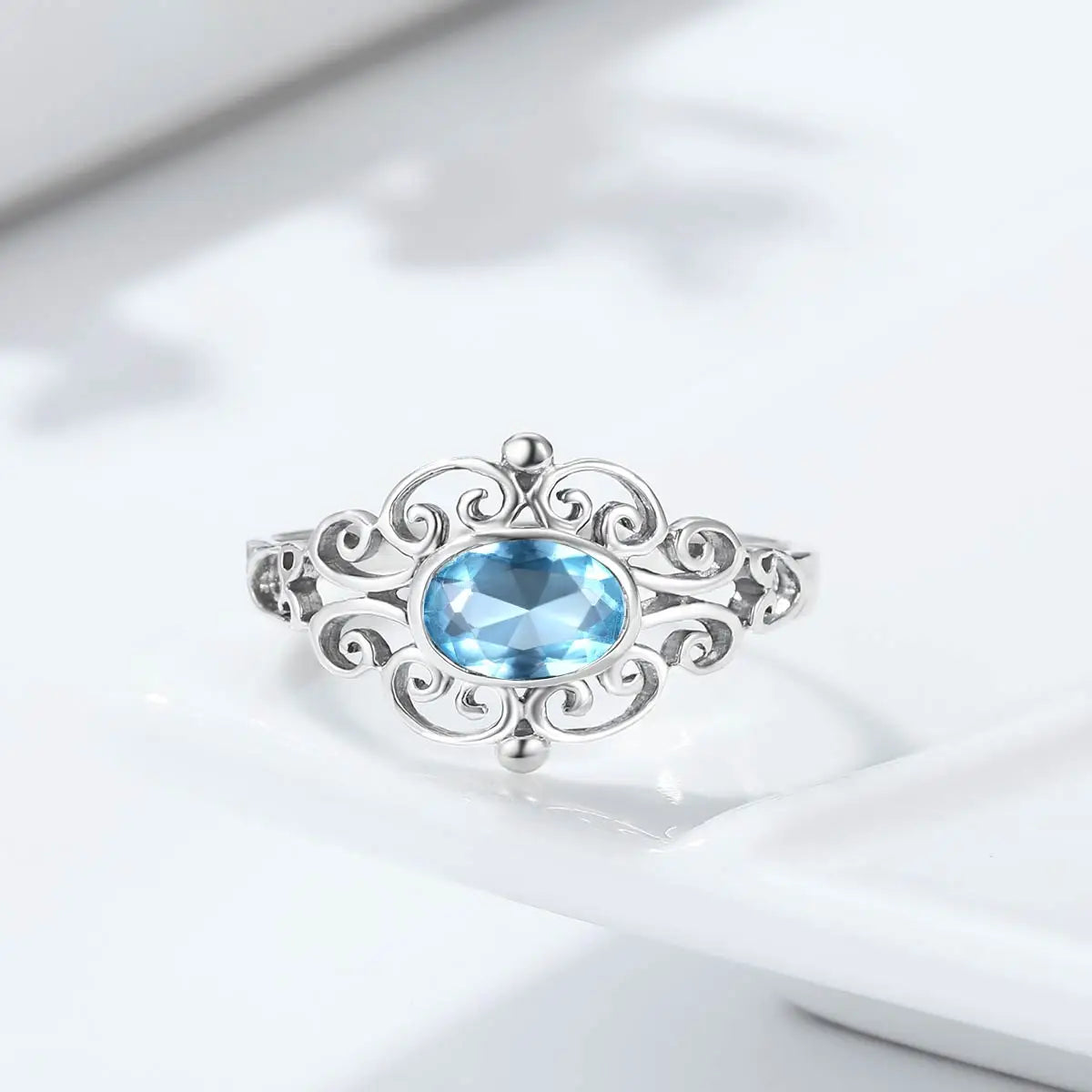 Jugendstil Aquamarin Ring aus 925er Silber mit ovalem Stein und Voluten