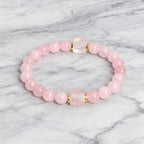 Rosenquarz Perlenarmband mit zwei Würfelsteinen