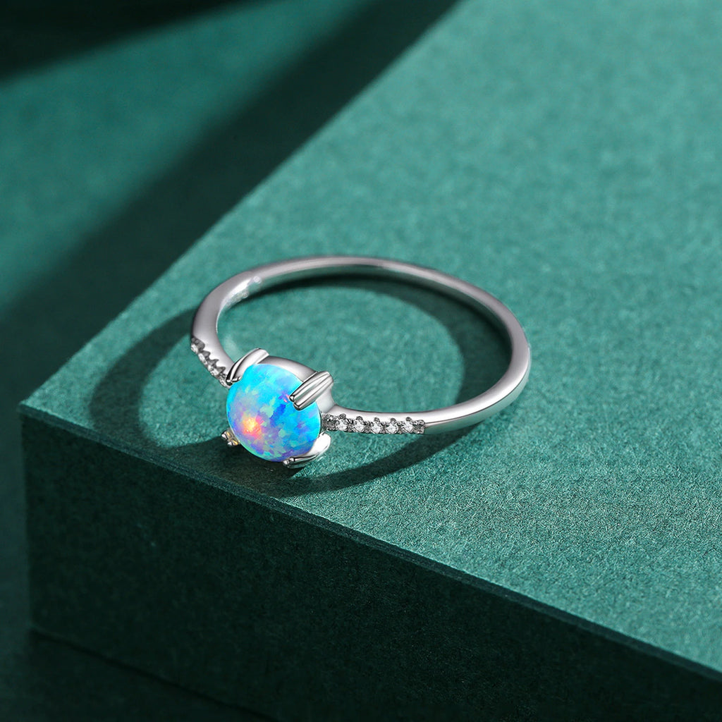 Blauer Opal Ring aus 925er Silber mit rundem Stein und Steinbesatz