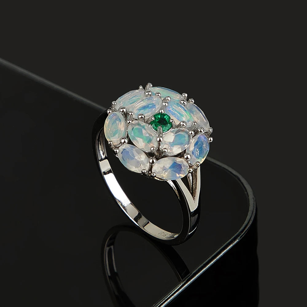 Opal Ring aus 925er Silber mit Smaragdzentrum und Opalblüte