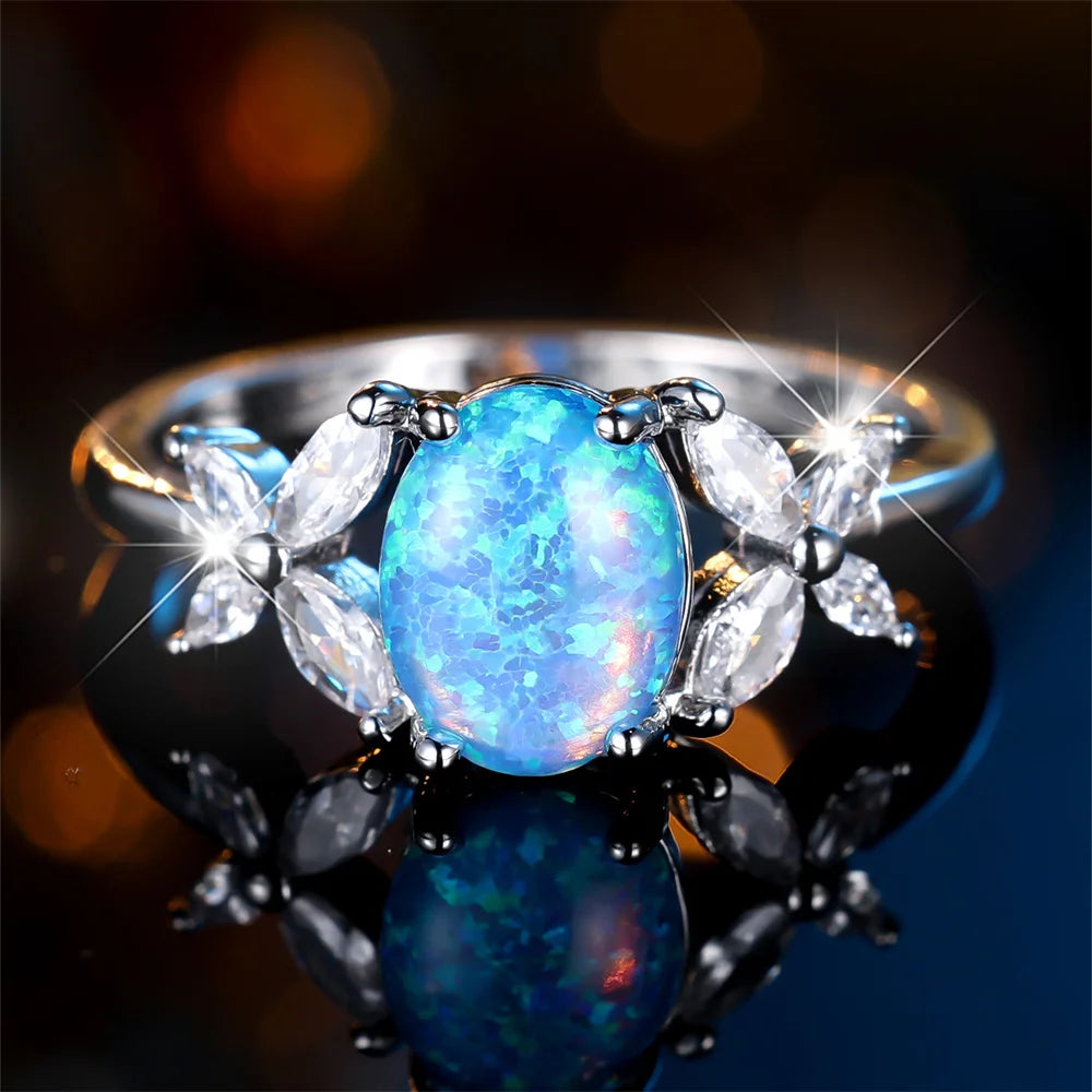 Blauer Opal Ring mit ovalem Stein und Blattmotiven