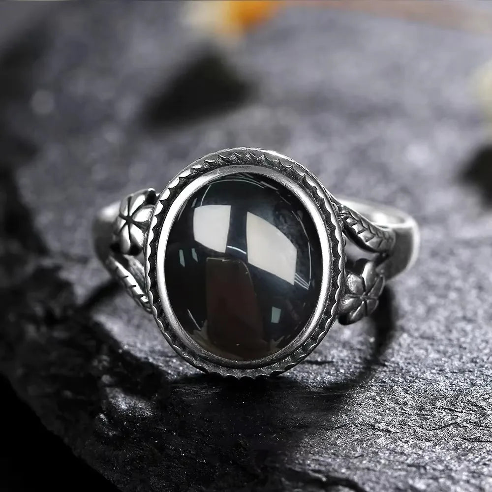 Onyx Ring aus 925er Silber mit Blüten und Zackenrahmen
