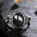 Onyx Ring aus 925er Silber mit Blüten und Zackenrahmen