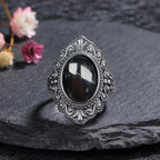 Vintage Onyx Ring aus 925er Silber mit ornamentalem Volutenrahmen