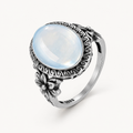 Aquamarin Cabochonring aus 925er Silber mit Blüten und Spiralrahmen