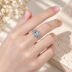 Jugendstil Aquamarin Ring aus 925er Silber mit ovalem Stein und Voluten