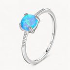 Blauer Opal Ring aus 925er Silber mit rundem Stein und Steinbesatz