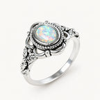 Opal Ring mit rundem Stein und Flechtrahmen