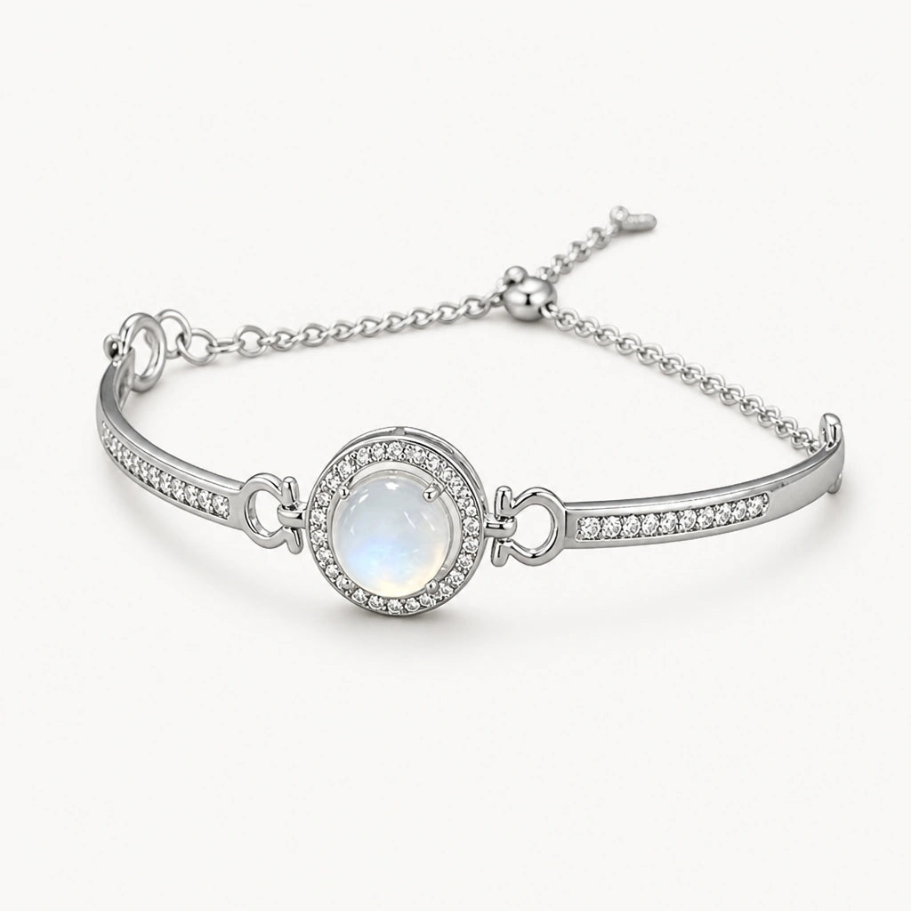 Mondstein Armreif mit rundem Cabochon und Ziersteinrahmen