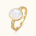 Gold Mondstein Ring mit ovalem Cabochon und offenem Design