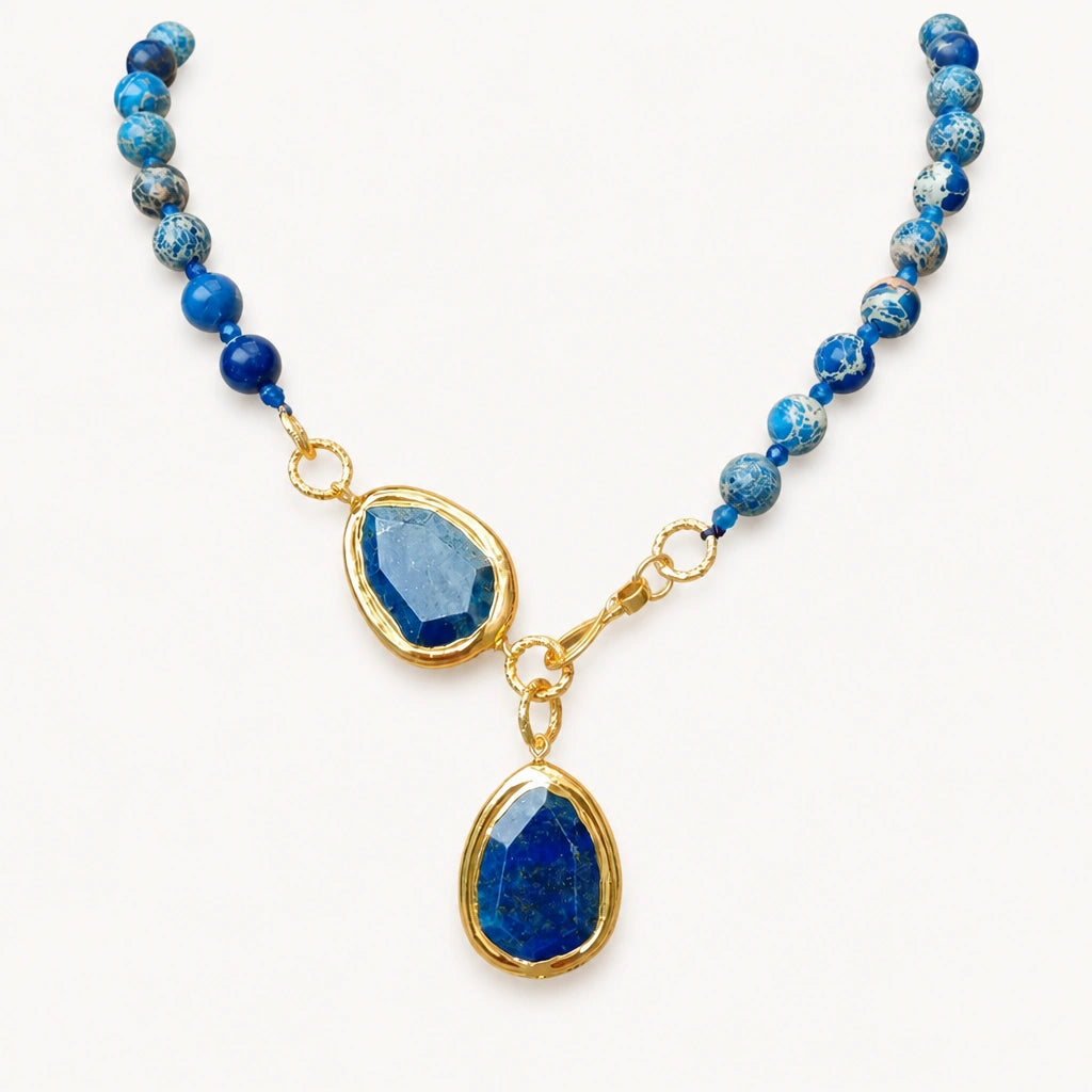 Lapislazuli Halskette mit facettierten Tropfenanhängern und Goldakzenten